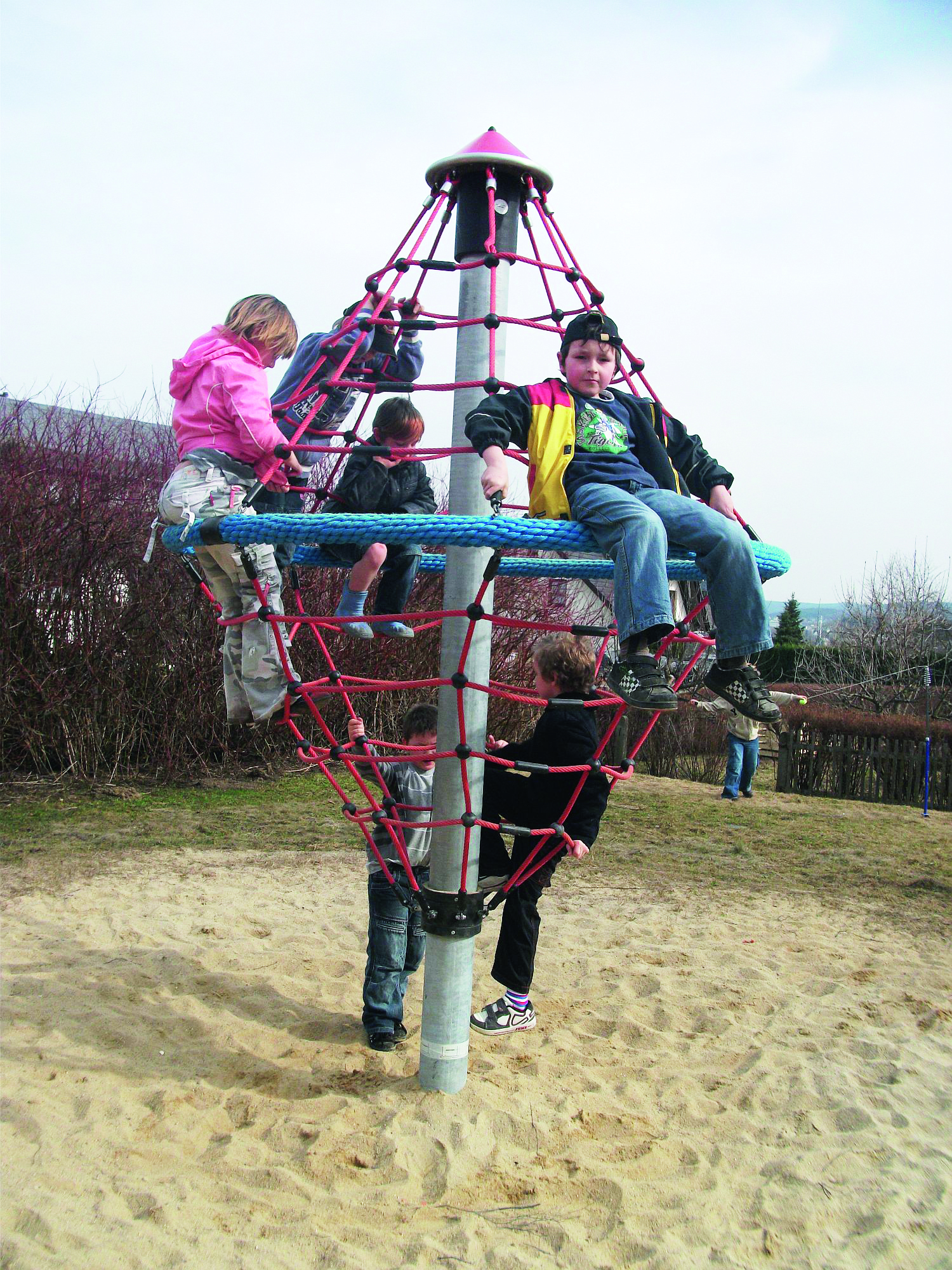 Kids Playing On Climbing Whirl